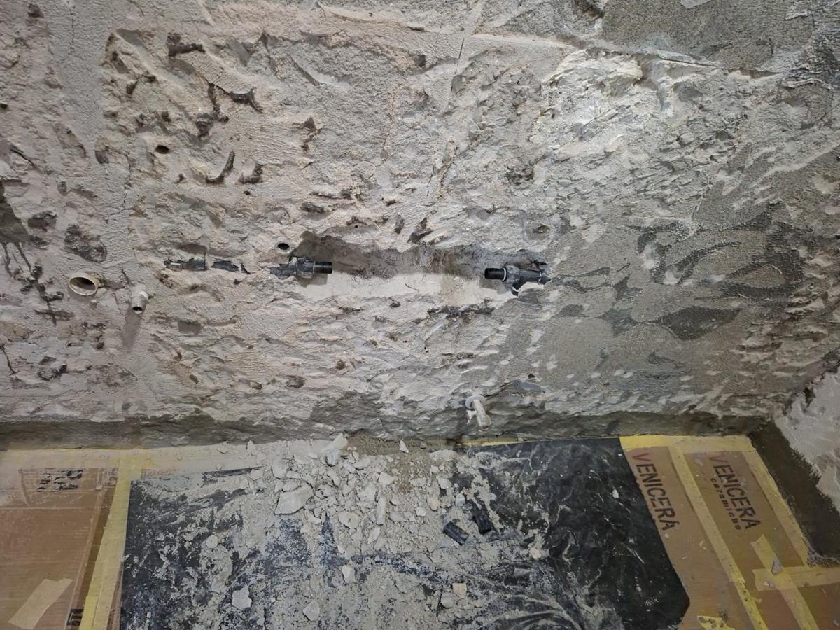 Hacked wall with new pipes
